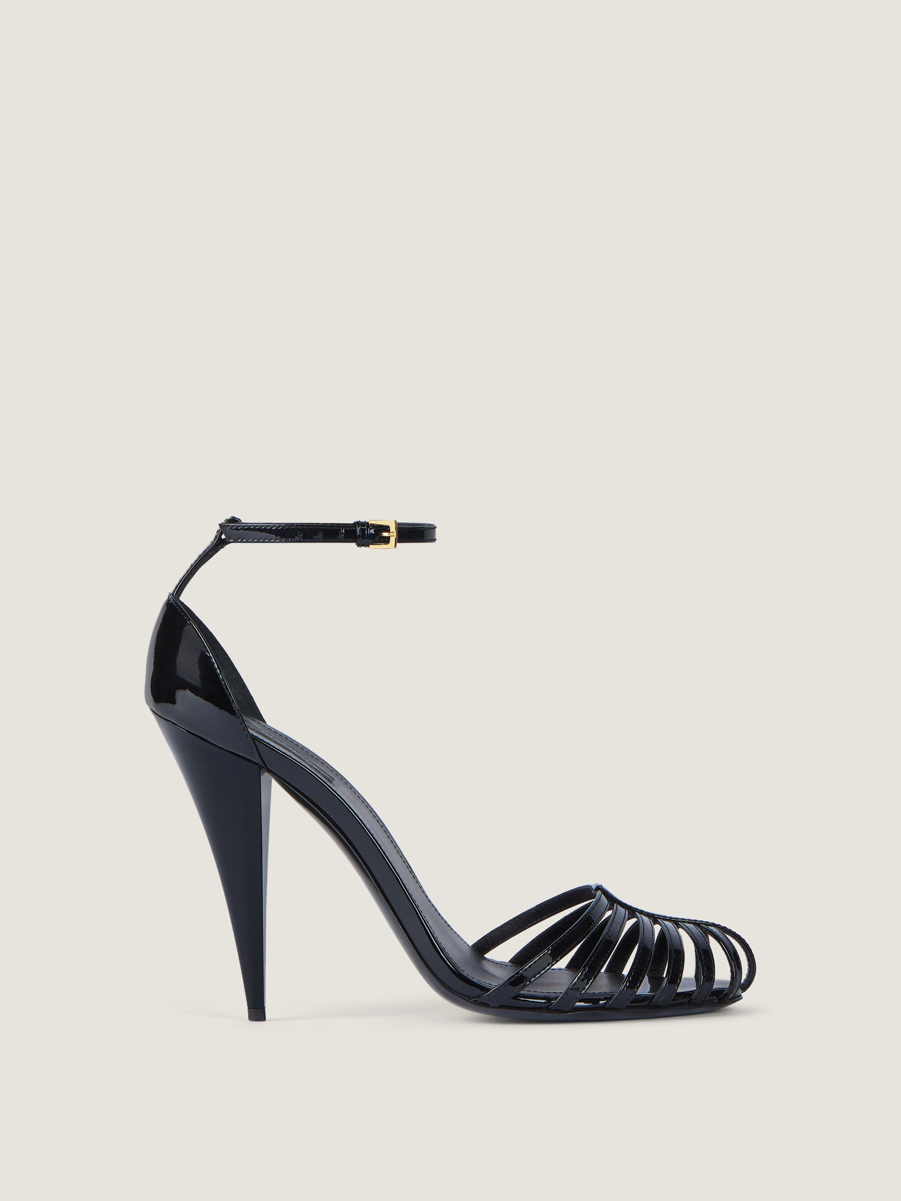 Cage heeled sandals in patent leather